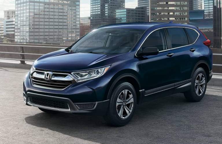 navy blue honda cr-v parked on top of parking ramp