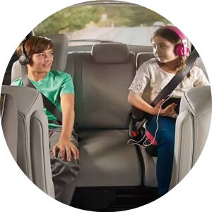 kids in the back seat of a minivan