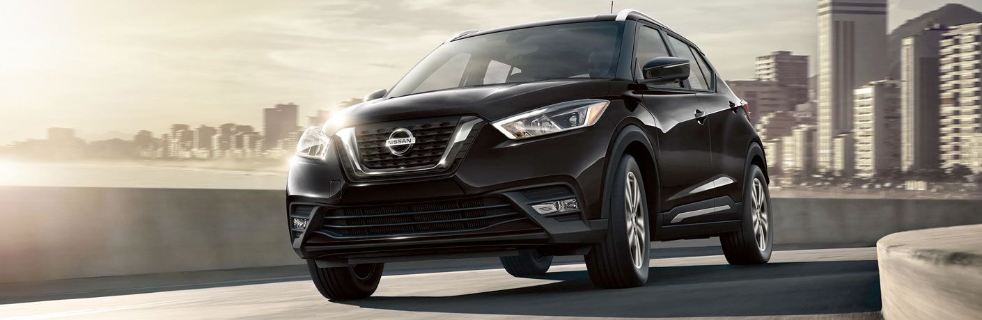 2020 Nissan Kicks driving down a winding road