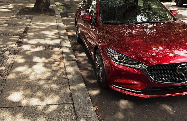 2018 Mazda6 parked next to a curb downtown