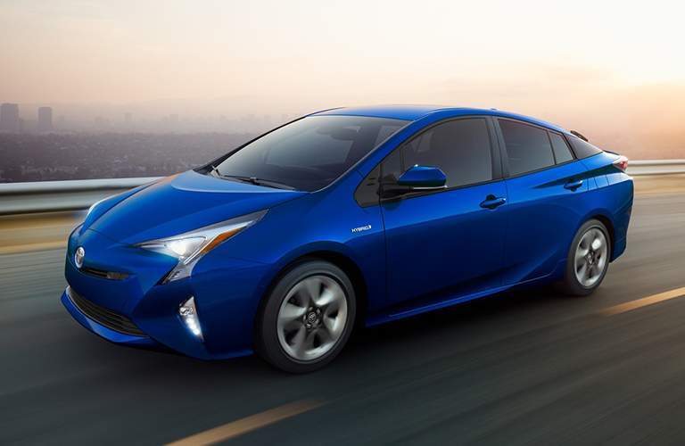 2018 Toyota Prius driving on the highway on a foggy day