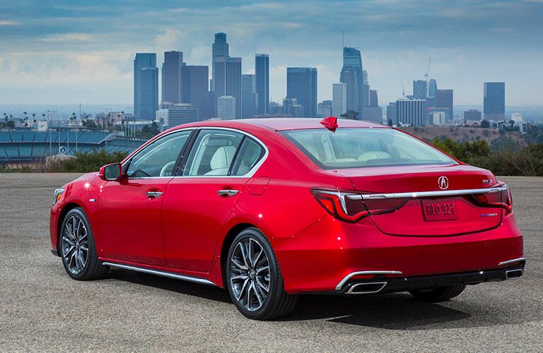 2019 Acura RLX with the city in the distance