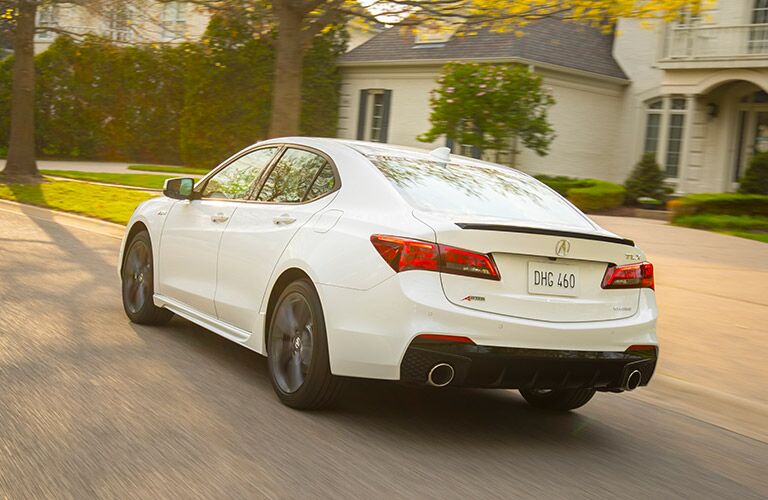 2019 Acura TLX driving in a neighborhood