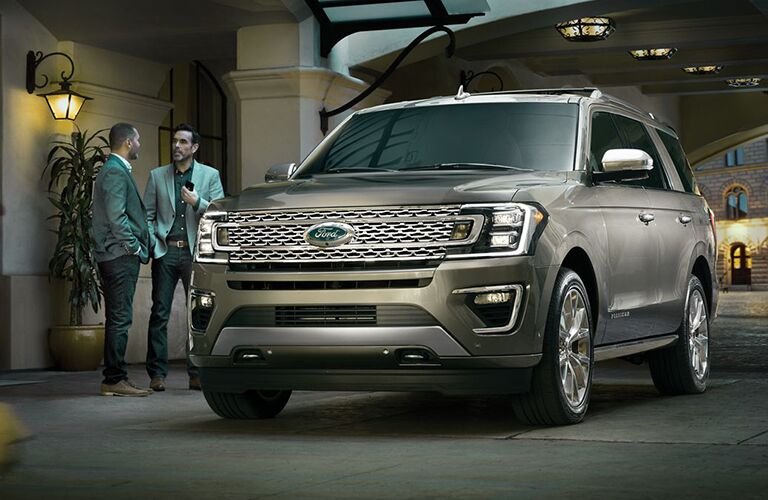 Two men standing next to the 2019 Ford Expedition talking