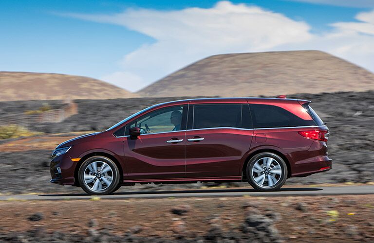 2019 Honda Odyssey driving past hills