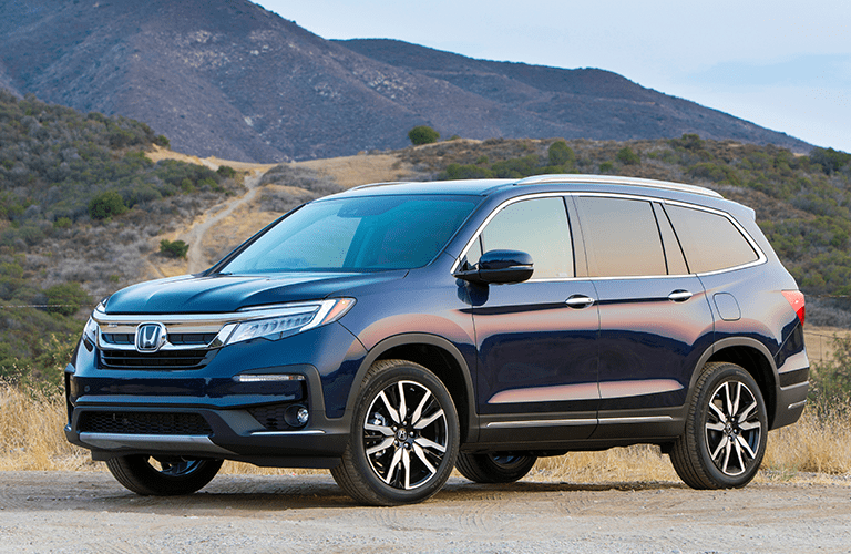 2019 Honda Pilot parked in front of hills