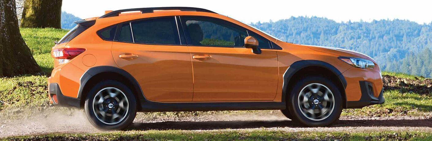 2019 Subaru Crosstrek driving by the mountains