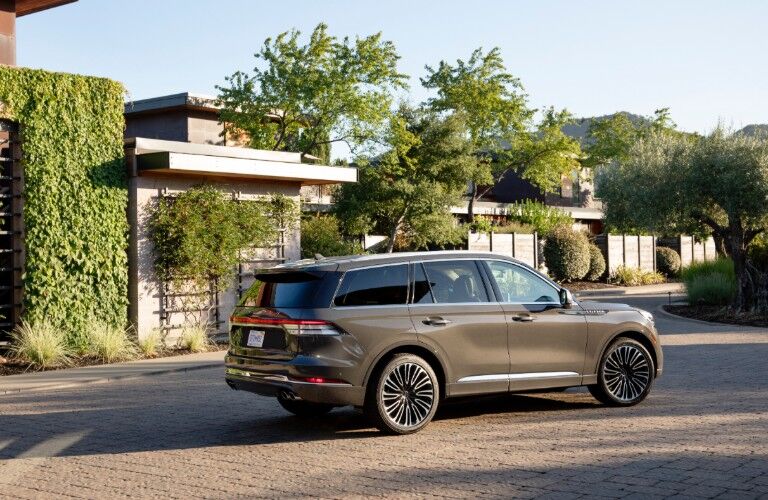 2020 Lincoln Aviator parked in front of a modern home