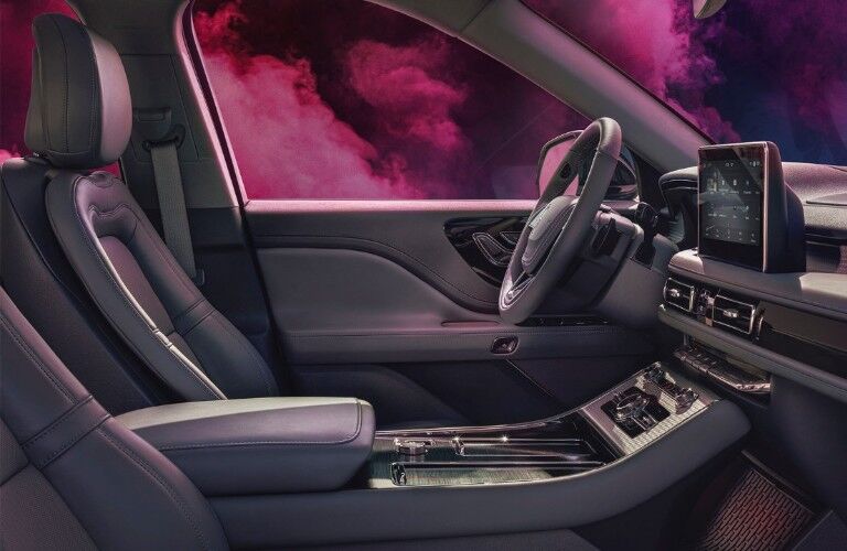 Cabin of the 2020 Lincoln Aviator with pink smoke outside the windows
