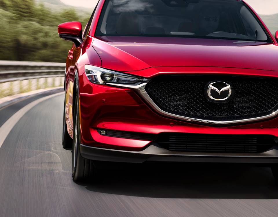 Front view of the 2019 Mazda CX-5 driving on a highway