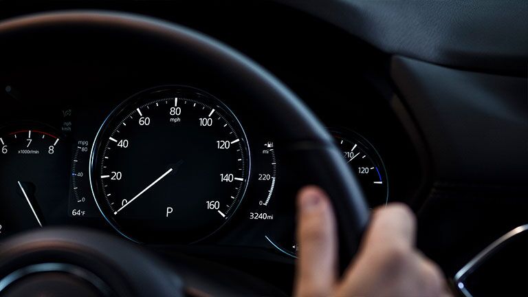 Instrument panel of the 2019 Mazda CX-5 as seen through the steering wheel