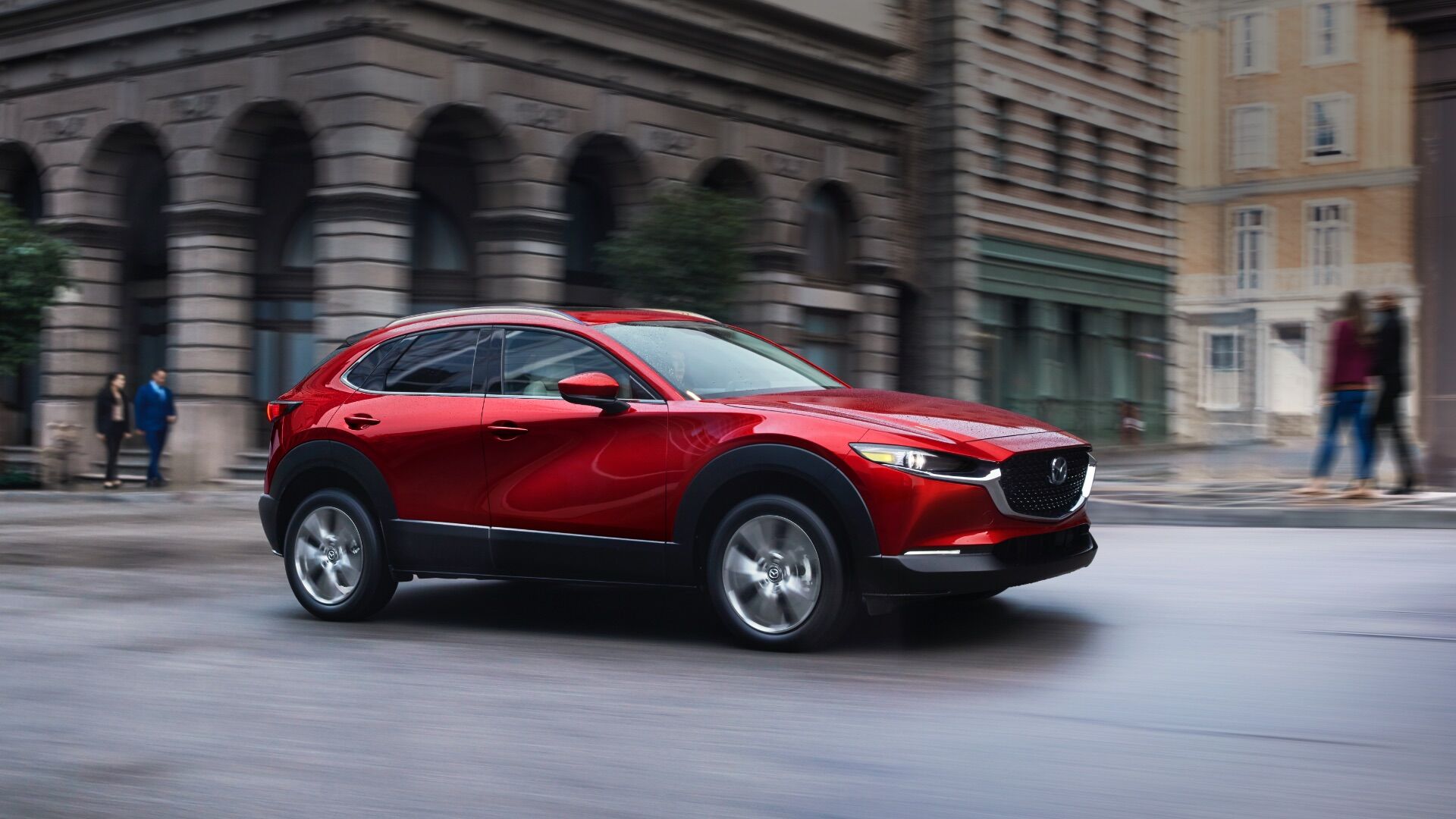 A 2020 mazdacx30 driving on a city street