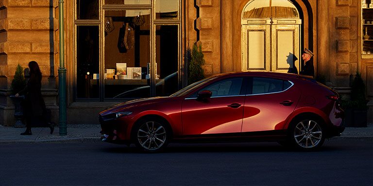 2019 Mazda3 Hatchback parked in front of a building