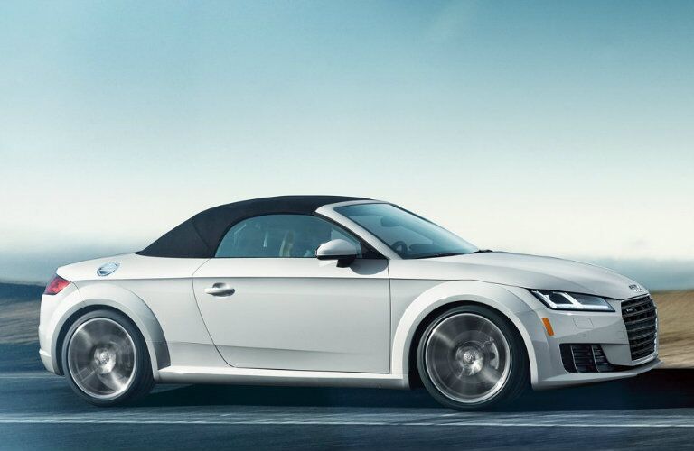 white Audi TT roadster driving on road