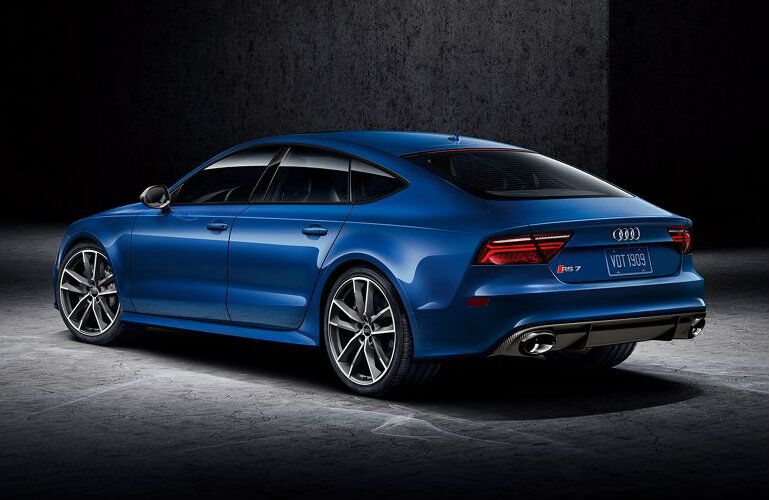 blue Audi RS 7 in dark garage