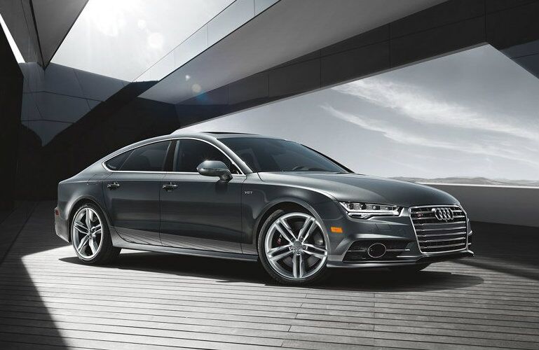 gray Audi S7 parked under modern structure
