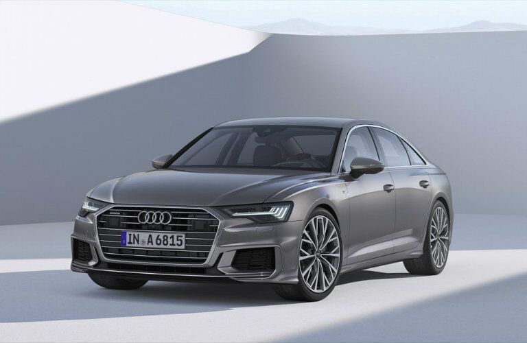 front view of gray Audi A6 parked in showroom
