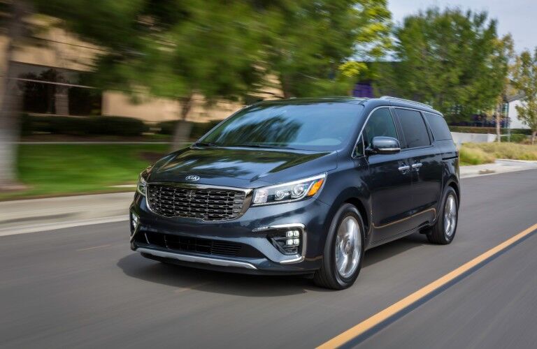 2020 Kia Sedona driving through suburbia