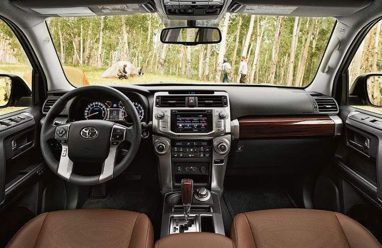 2018 Toyota 4Runner brown seats with steering wheel and dashboard prominently shown