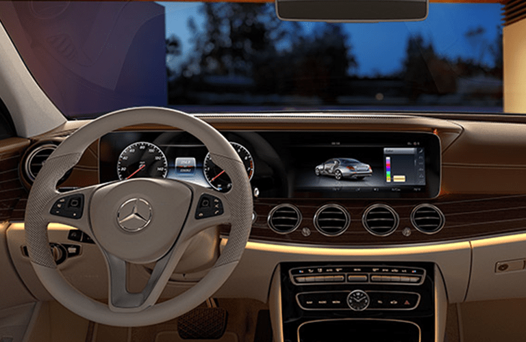 tan steering wheel and center console display in 2018 Mercedes-Benz E-Class