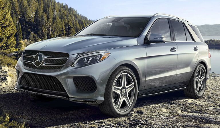 side view of a 2018 Mercedes-Benz GLE parked by a mountain lake
