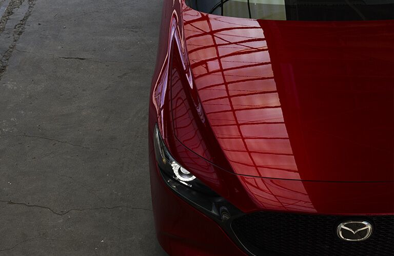 red mazda3 front end close up