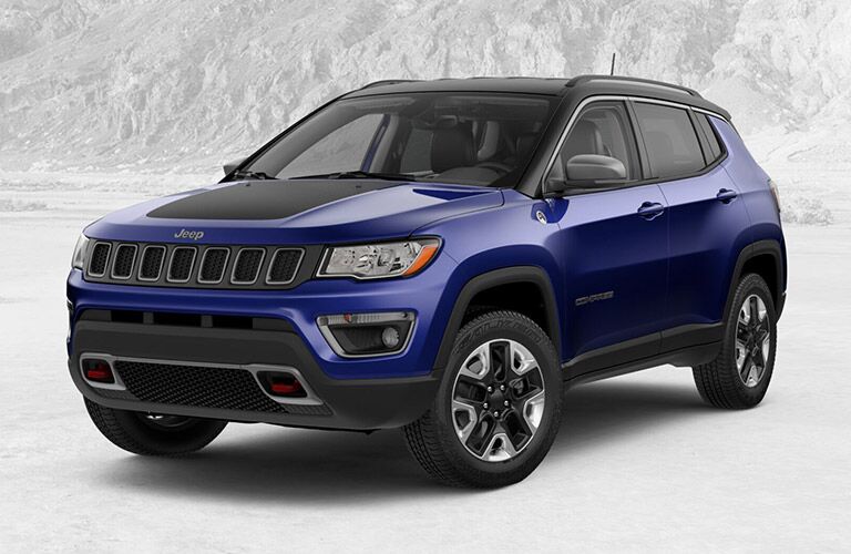 2018 Jeep Compass in blue parked in the snow