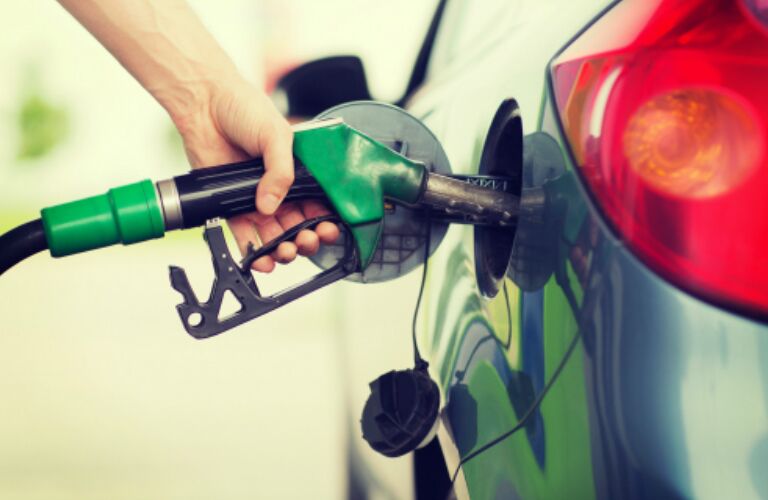 driver filling up their gas tank