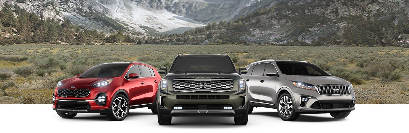 2020 Kia Sportage Sorento and Telluride in front of a mountain valley