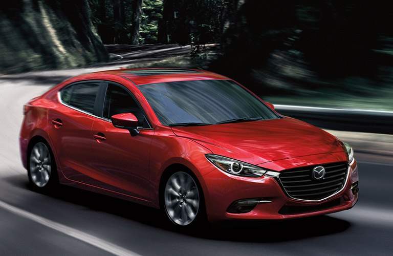 2018 Mazda3 exterior shot driving through forest road