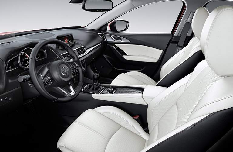 2018 Mazda3 interior front seating, dashboard, and steering wheel