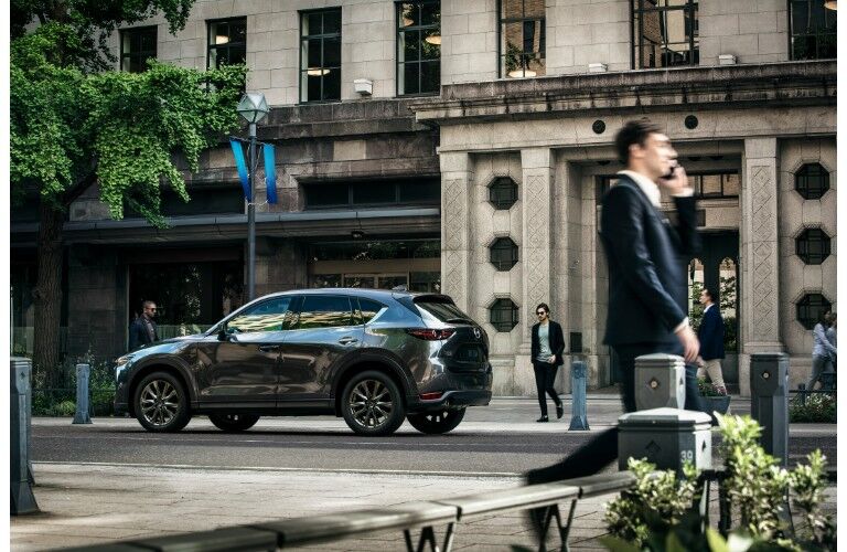 Silver 2019 Mazda CX-5 in front of building