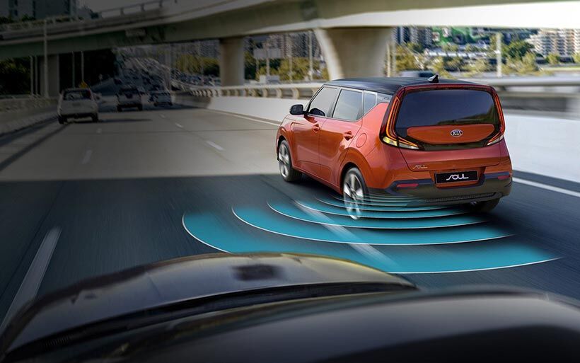 Illustrated image of a 2020 Kia Soul's blind-spot collision warning system in action