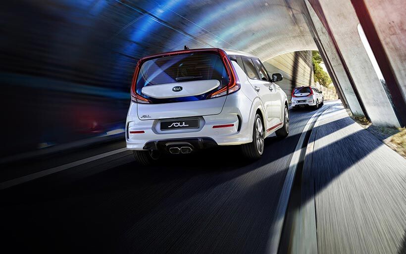 Two 2020 Kia Soul driving down a highway with illustrated distance detection