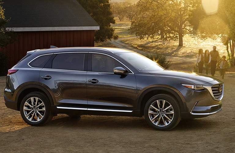 silver mazda cx-9 parked on dirt