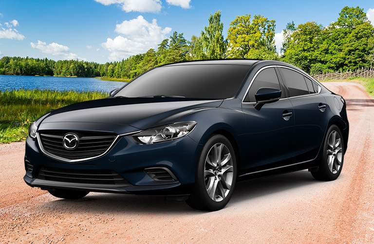 blue mazda6 on beach