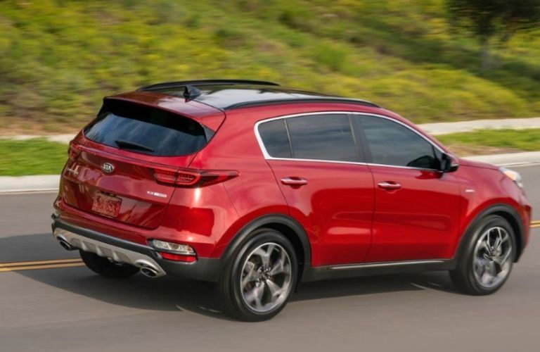 2021 Kia Sportage driving rear view