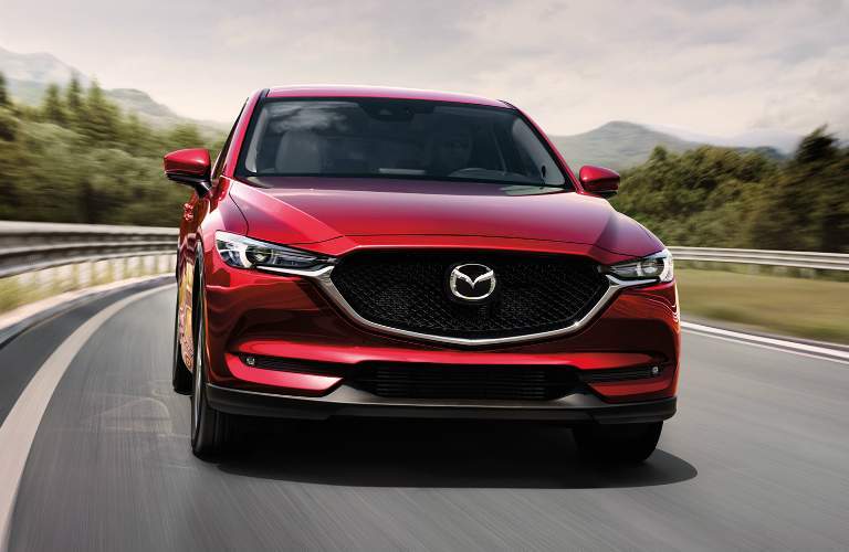 red 2018 mazda cx-5 driving on highway