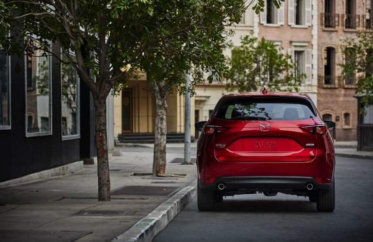 rear view of red 2018 mazda cx-5 parked on city street
