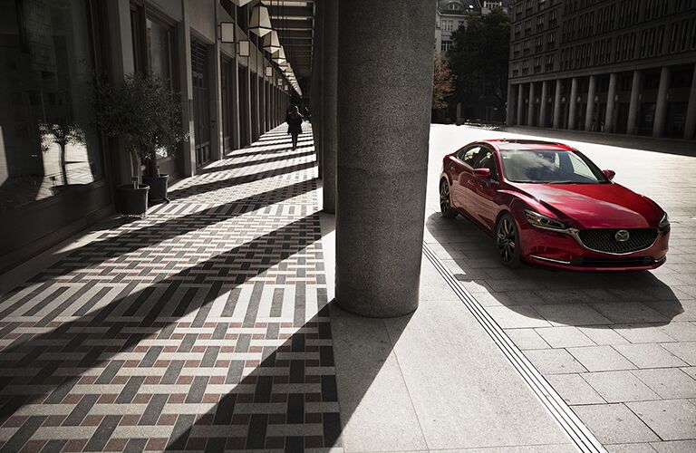 red 2018 mazda6 parked on concrete street