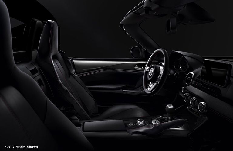 side view of front seats of 2018 mazda miata with top down