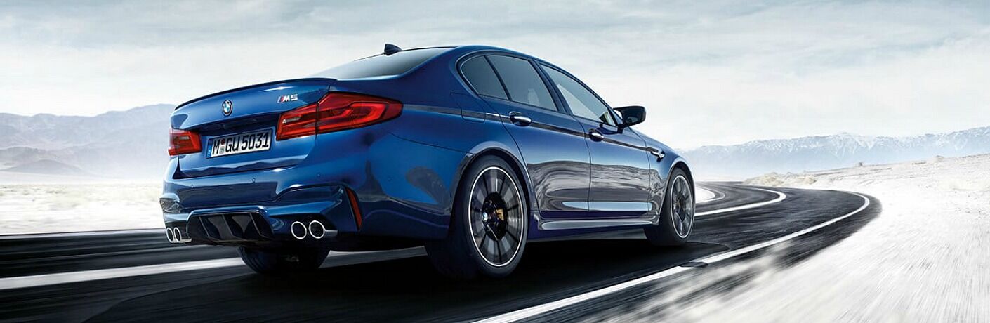 2018 BMW M5 blue side back view