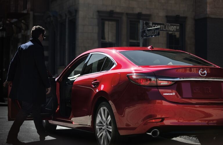 2019 Mazda6 red back view with man getting in