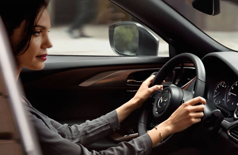 2019 Mazda CX-9 interior with woman driving