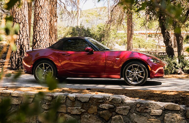 2019 Mazda MX-5 Miata red side view on the road