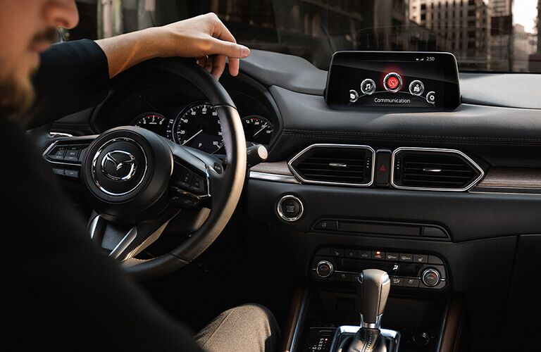 2020 Mazda CX-5 interior view with a man in the driver's seat