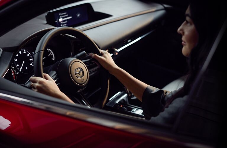 2020 Mazda CX-30 woman in driver's seat