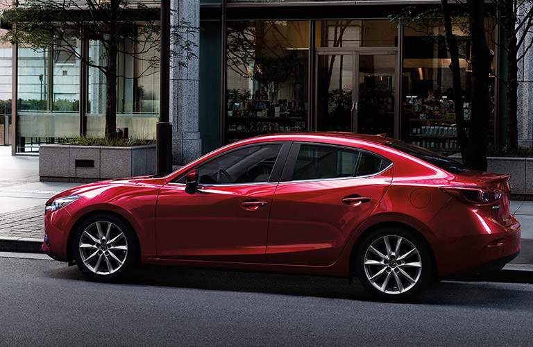 2018 Mazda3 in front of a store downtown