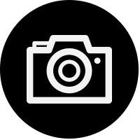 Black dot with icon of a camera