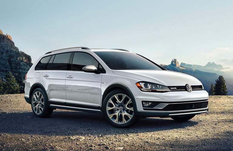 white volkswagen golf alltrack parked